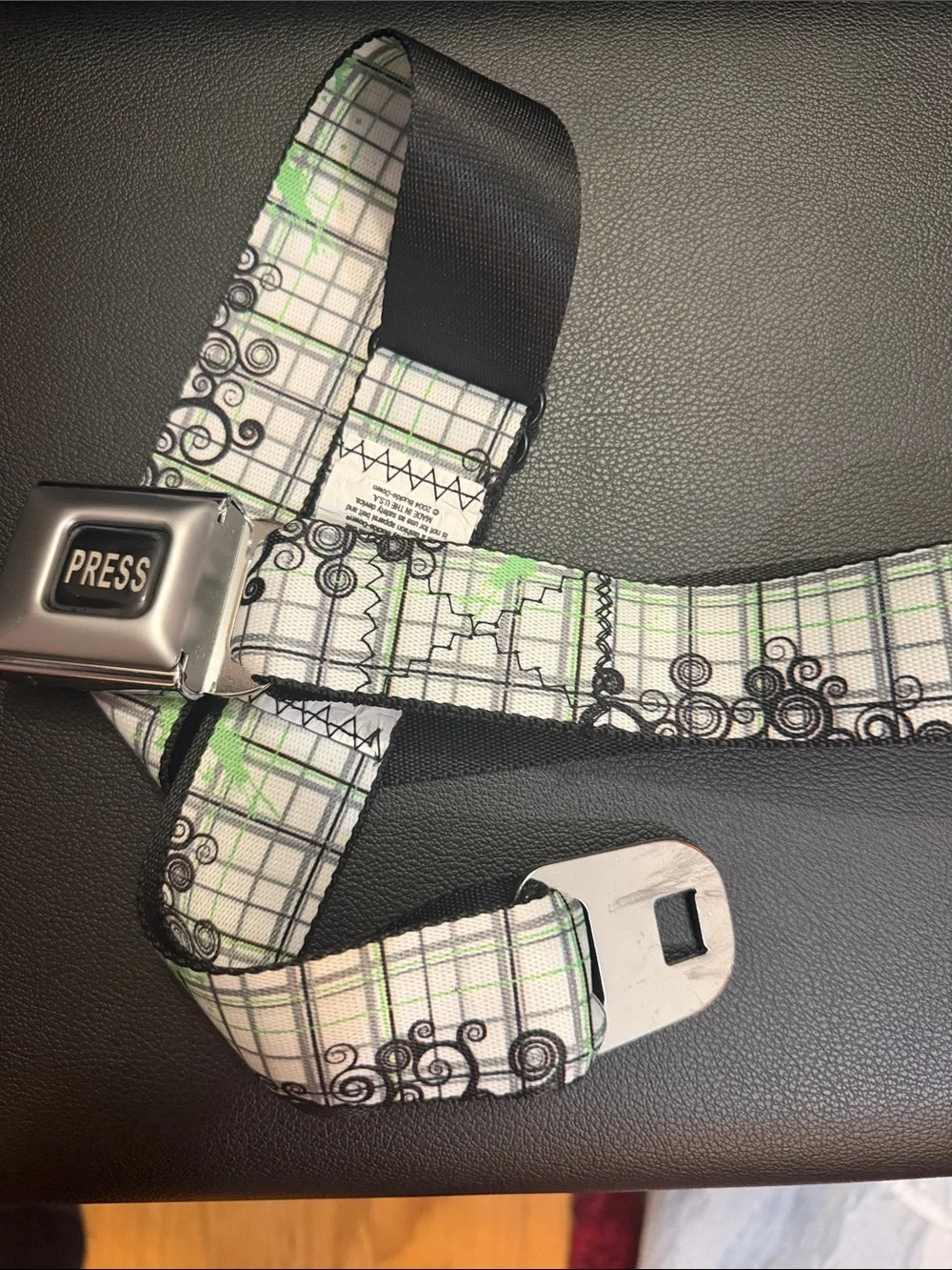 Buckle-Down White & Green Plaid Seatbelt belt with Black Swirl Accents